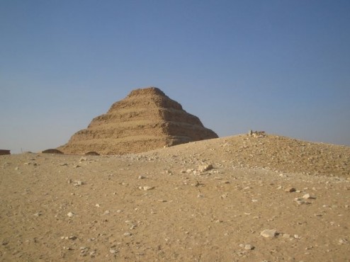 Pyramid of Djozer, Saqqara, half hidden by Egyptian sand dunes