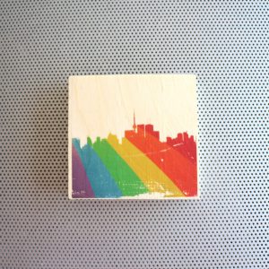 SIlhouette of Toronto with rainbow Pride spray art