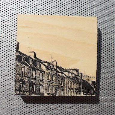 Old stone rowhouses in Cherbourg, France, printed on wood