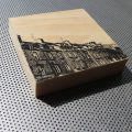 Old stone rowhouses in Cherbourg, France, printed on wood