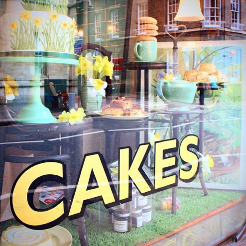 Cakes signage on a tearoom in Cambridge, England, dainty teacakes and teapots