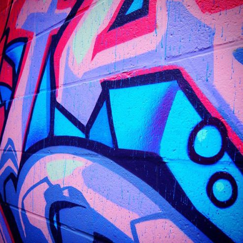 Pink and blue spray art graffiti in Toronto's Graffiti Alley