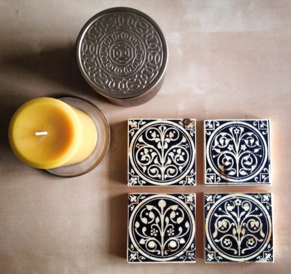 beautiful styling of four wood art blocks with a hammered tin candle