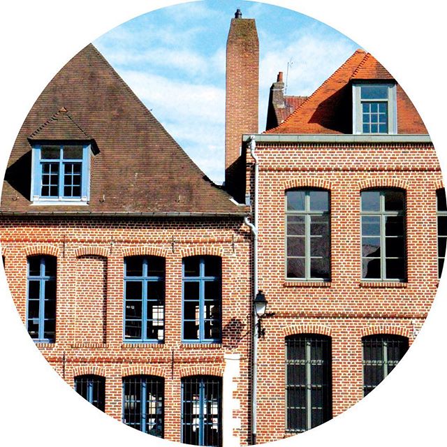 Red brick buildings against a blue sky in Lille, France
